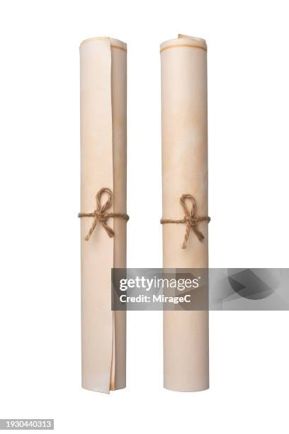old brown paper rolls isolated on white - paper scroll stock pictures, royalty-free photos & images