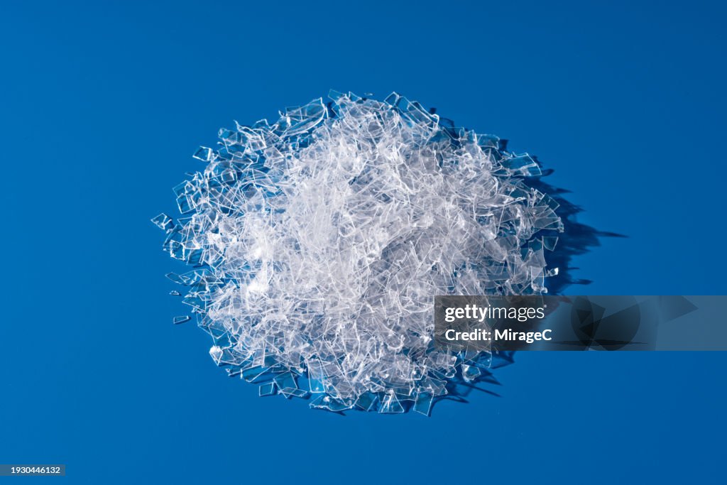 Heap of Shredded PET Plastic Flakes for Recycling and Reusing
