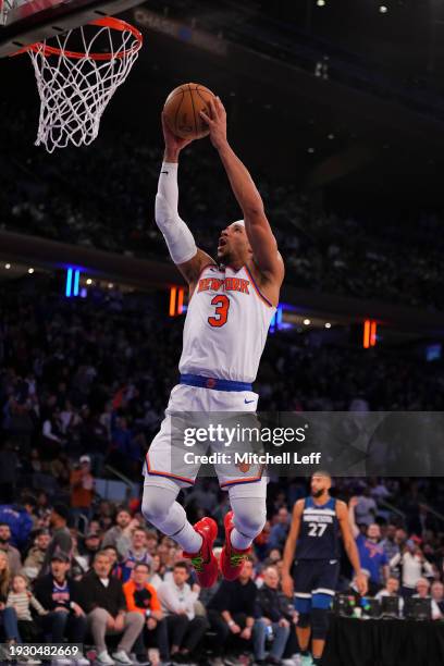 Josh Hart of the New York Knicks dunks the ball against the Minnesota Timberwolves at Madison Square Garden on January 1, 2024 in New York City. The...