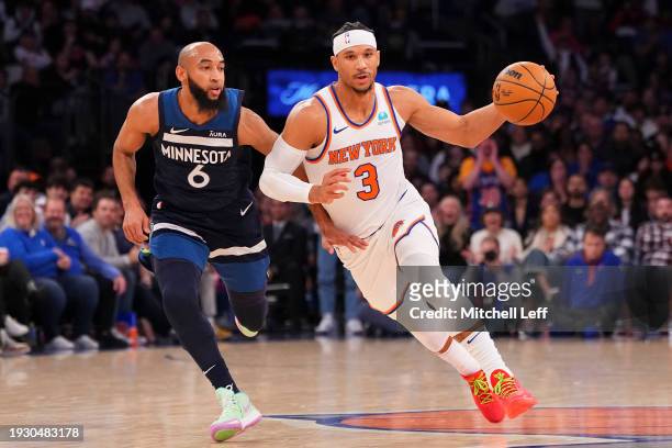 Josh Hart of the New York Knicks dribbles the ball against Jordan McLaughlin of the Minnesota Timberwolves at Madison Square Garden on January 1,...