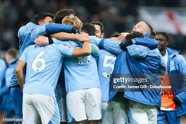 Oscar Bobb of Manchester City celebrates with teammates after the Premier League match between Newcastle United and Manchester City at St. James Park...