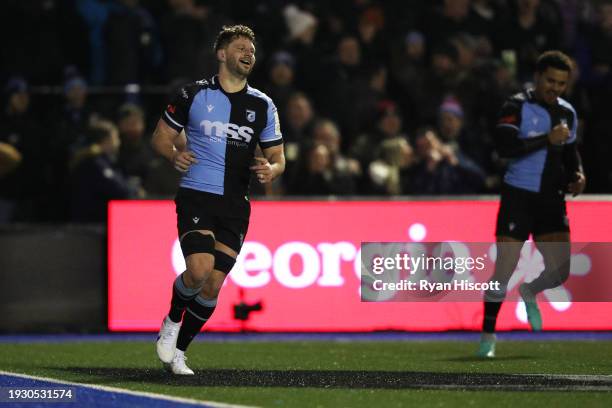 Thomas Young of Cardiff Rugby celebrates scoring their team's second try during the Investec Champions Cup match between Cardiff Rugby and Harlequins...