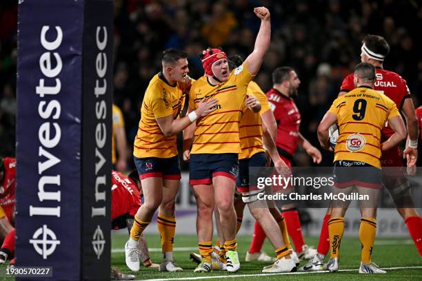 Tom Stewart of Ulster Rugby celebrates with teammates after scoring their team's first try during the Investec Champions Cup match between Ulster...