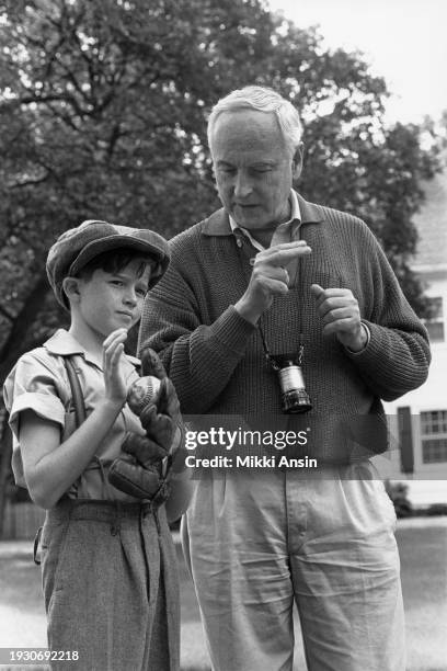 American film director James Ivory instructs a unidentified child actor holding a baseball and a mitt during the filming of 'Mr & Mrs Bridge', Kansas...