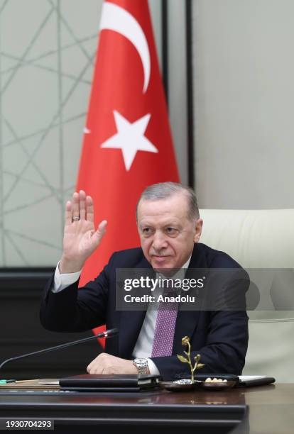 Turkish President Recep Tayyip Erdogan gestures as he conducts video conference meeting with the first Turkish astronaut, Alper Gezeravci, who is...