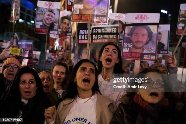 People react during a rally to mark 100 days of captivity for hostages by Hamas in Gaza on January 13, 2024 in Tel Aviv, Israel. The protest featured...