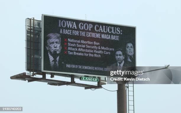 Digital billboard critical of the Republican presidential candidates stands in blizzard conditions on January 13, 2024 in Council Bluffs, Iowa. The...