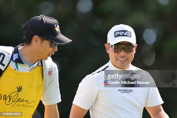 Taiga Semikawa of Japan walks off the fifth tee with caddie, Junya Takahashi during the third round of the Sony Open in Hawaii at Waialae Country...