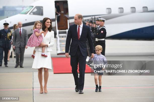 Britain's Prince William, Duke of Cambridge and his wife Kate, Duchess of Cambridge with their children Prince George and Princess Charlotte arrive...