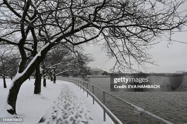 The Jefferson Memorial is seen across the Tidal Basin in Washington, DC, on January 16, 2024. The Washington DC metro region received between 2 and 4...