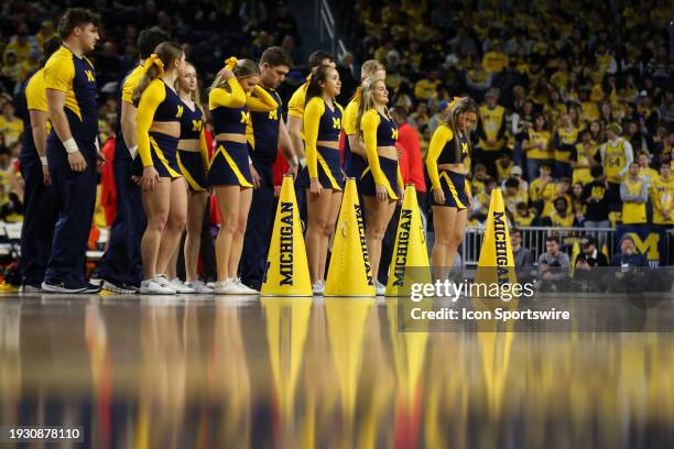 Michigan cheerleaders perform during a timeout during a Big Ten Conference college basketball game between the Ohio State Buckeyes and the Michigan...