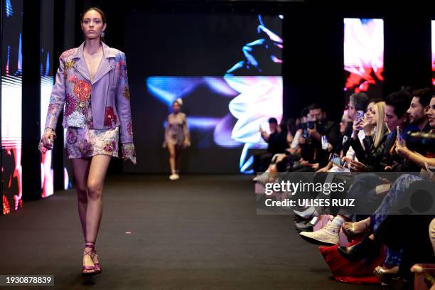 Model presents a creation of the spring-summer collection "La Dahlia" by Mexican designer house Josefina by Vero Solis that uses elements related to...