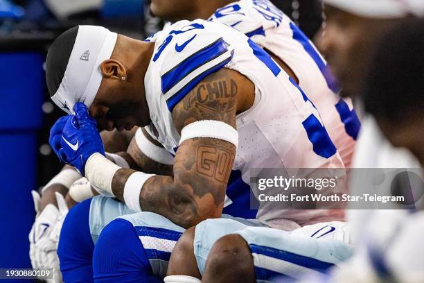 Cowboys defensive back Juanyeh Thomas holds his head down in disappointment while getting blown out in the fourth quarter of the NFC Wild Card game...