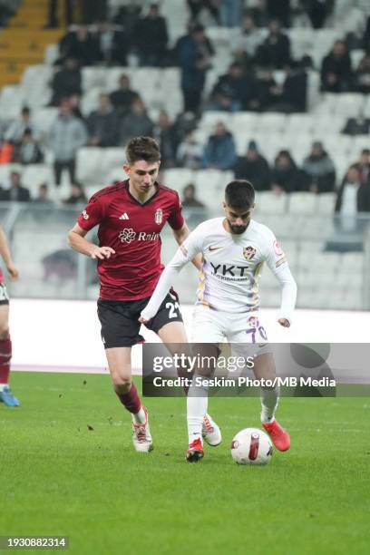 Ege Tiknaz of Besiktas and Mete Kaan Demir of Eyupspor battle for the ball during the Ziraat Turkish Cup match between Besiktas and Eyupspor at...