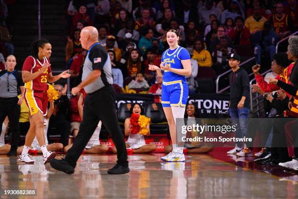 Trojans guard McKenzie Forbes celebrates a turnover on UCLA Bruins forward Lina Sontag during the women's college basketball game between the UCLA...