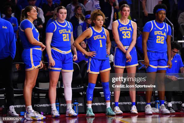 Bruins forward Lina Sontag , UCLA Bruins guard Kiki Rice , UCLA Bruins forward Amanda Muse and UCLA Bruins forward Christeen Iwuala look on from the...