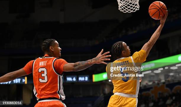 Ishmael Leggett of the Pittsburgh Panthers goes to the basket past Judah Mintz of the Syracuse Orange in the first half during the game at Petersen...