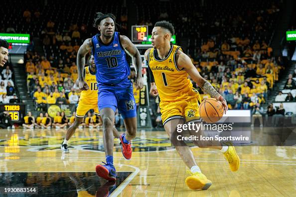 Xavier Bell Wichita State Shockers guard Xavier Bell drives around Memphis Tigers ...