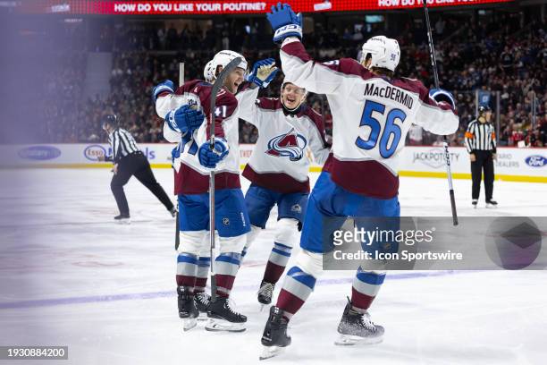 Avalanche Right Wing Jason Polin celebrates his first career NHL goal with teammates including Center Fredrik Olofsson and Winger Kurtis MacDermid...