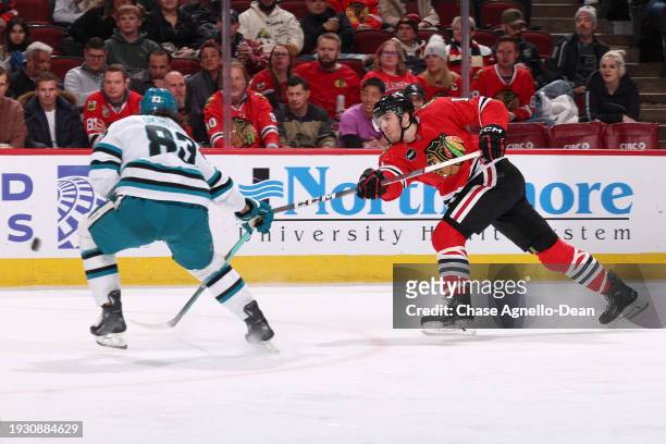 Taylor Raddysh of the Chicago Blackhawks hits the puck in the second period against the San Jose Sharks at the United Center on January 16, 2024 in...