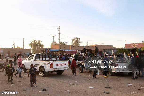 General view of pickup trucks waiting to travel to the Libyan border at the Agadez bus station in Agadez on January 2, 2024. Agadez, nicknamed the...