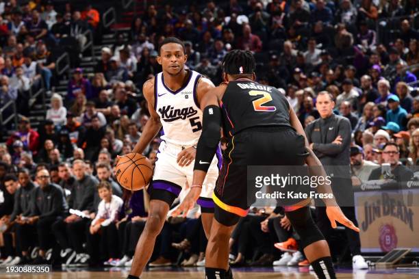 January 16: De'Aaron Fox of the Sacramento Kings handles the ball during the game against the Phoenix Suns on January 16, 2024 at Footprint Center in...