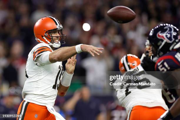 Joe Flacco of the Cleveland Browns throws an interception against the Cleveland Browns for a pick-six during the third quarter in the AFC Wild Card...