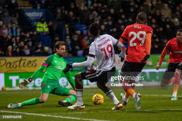 Tim Krul, #23 of Luton Town F.C., is making a save from Paris Maghoma, #19 of Bolton Wanderers, during the FA Cup Third Round Replay match between...