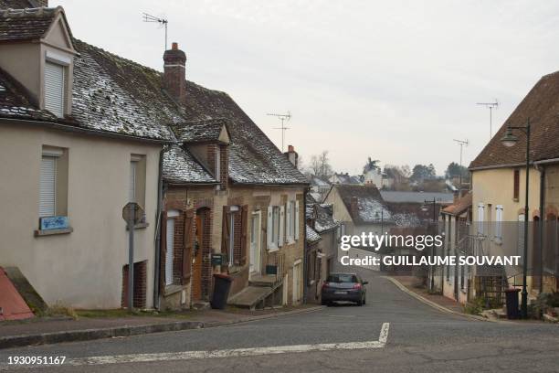 This photograph taken on January 16 shows a street of the Douchy village near the residence of French actor Alain Delon named La Brulerie, central...