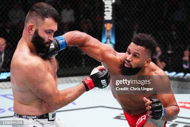 Waldo Cortes-Acosta of the Dominican Republic punches Andrei Arlovski of Belarus in a heavyweight fight during the UFC Fight Night event at UFC APEX...