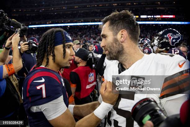 Stroud of the Houston Texans meets with Joe Flacco of the Cleveland Browns following an NFL wild-card playoff football game between the Houston...