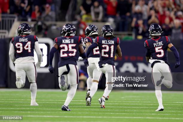 Steven Nelson of the Houston Texans returns an interception for a touchdown against the Cleveland Browns during the third quarter in the AFC Wild...