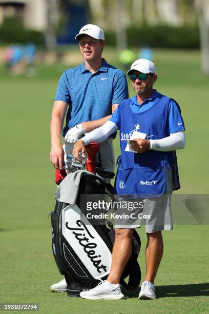 Cameron Davis of Australia prepares for a shot on the sixth hole with caddie, Andrew Tschudin during the third round of the Sony Open in Hawaii at...