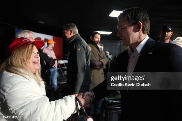 Republican presidential candidate Florida Gov. Ron DeSantis greets supporters at a campaign event at The Grass Wagon on January 13, 2024 in Council...