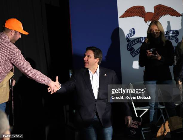 Republican presidential candidate Florida Gov. Ron DeSantis greets supporters at a campaign event at The Grass Wagon on January 13, 2024 in Council...