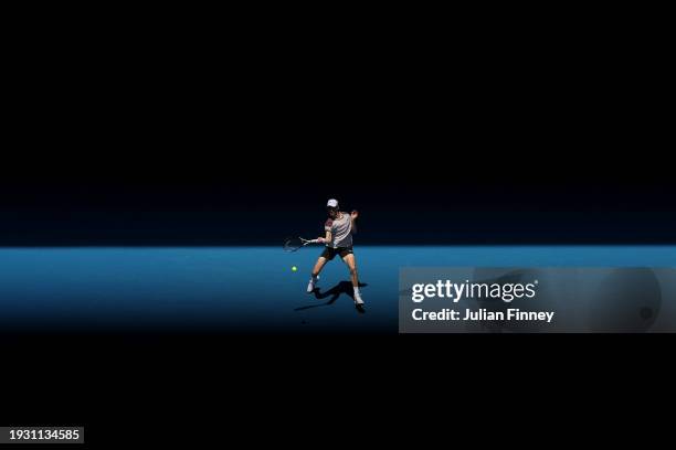 Jannik Sinner of Italy plays a forehand in their round one singles match against Botic van de Zandschulp of the Netherlands during day one of the...