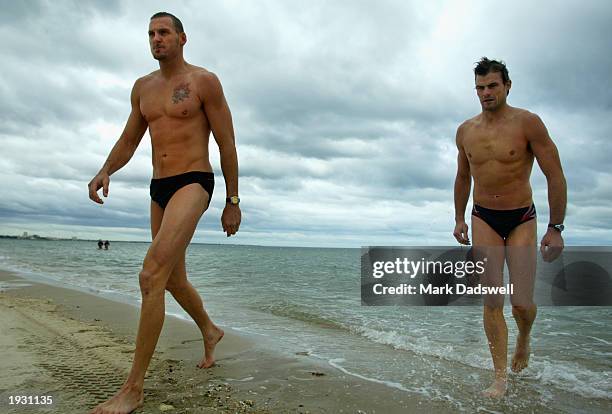 Daniel Bandy and Luke Darcy of the Bulldogs leave the cold water during the Western Bulldogs recovery session at Port Melbourne, Melbourne, Australia...