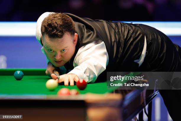 Shaun Murphy of England plays a shot in the Semi-final match against Ronnie O'Sullivan of England on day 7 of the 2024 MrQ Masters Snooker at...