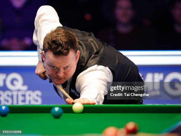 Shaun Murphy of England plays a shot in the Semi-final match against Ronnie O'Sullivan of England on day 7 of the 2024 MrQ Masters Snooker at...