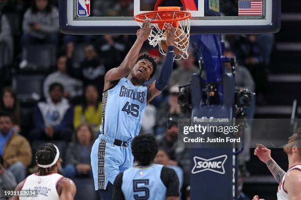 Jackson of the Memphis Grizzlies dunks during the first half against the New York Knicks at FedExForum on January 13, 2024 in Memphis, Tennessee....