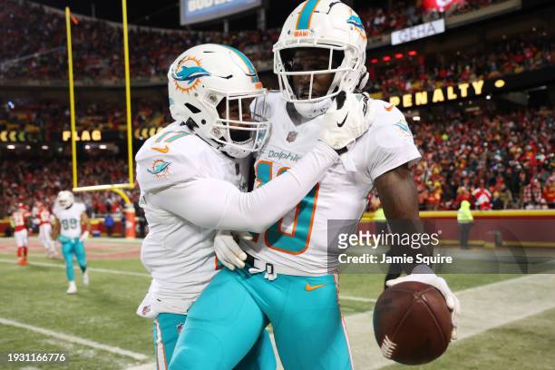 Tyreek Hill of the Miami Dolphins celebrates with Jaylen Waddle after scoring a touchdown during the second quarter against the Kansas City Chiefs in...