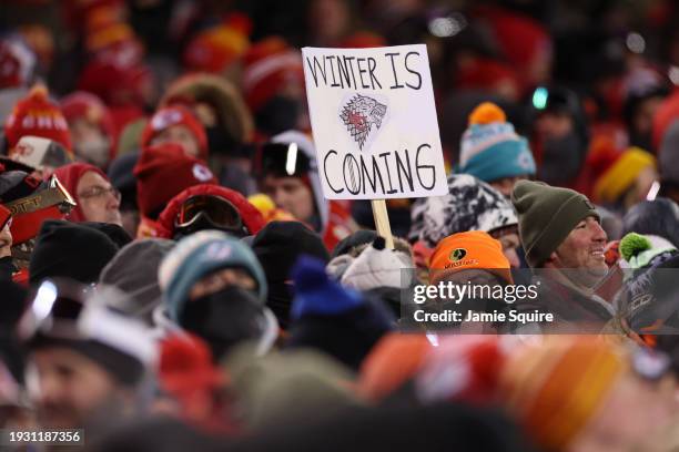 Fan holds a sign during the AFC Wild Card Playoffs between the Miami Dolphins and the Kansas City Chiefs at GEHA Field at Arrowhead Stadium on...