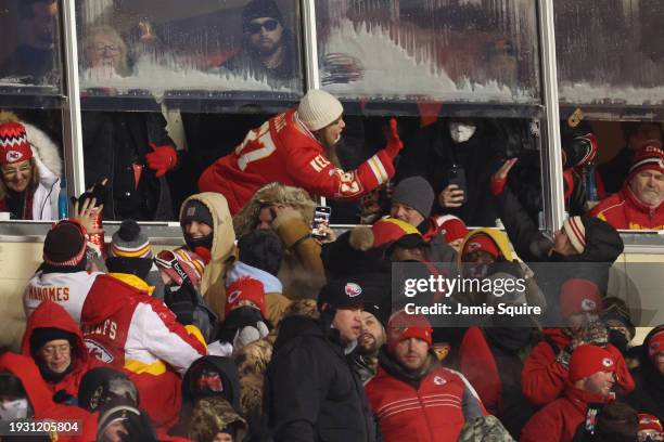 Taylor Swift celebrates with fans during the AFC Wild Card Playoffs between the Miami Dolphins and the Kansas City Chiefs at GEHA Field at Arrowhead...