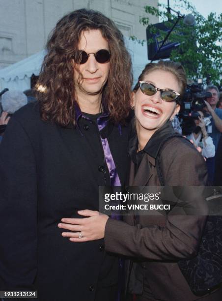 Radio personality Howard Stern and actress Julia Roberts arrive for the 4th Annual Blockbuster Entertainment Awards10 March in Hollywood, CA. Roberts...
