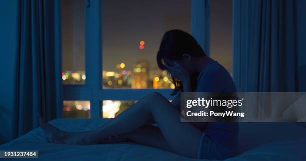 woman feel depression at night - sexual harassment stock pictures, royalty-free photos & images