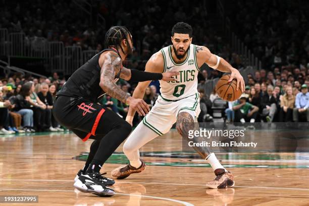 Jaylen Brown of the Boston Celtics drives to the basket against Cam Whitmore of the Houston Rockets during the second quarter at the TD Garden on...