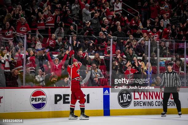 Brett Pesce of the Carolina Hurricanes celebrates after scoring the game-winning goal in overtime to defeat the Pittsburgh Penguins 3-2 at PNC Arena...