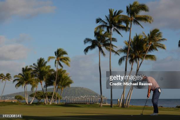 Keith Mitchell of the United States putts on the 17th green during the third round of the Sony Open in Hawaii at Waialae Country Club on January 13,...