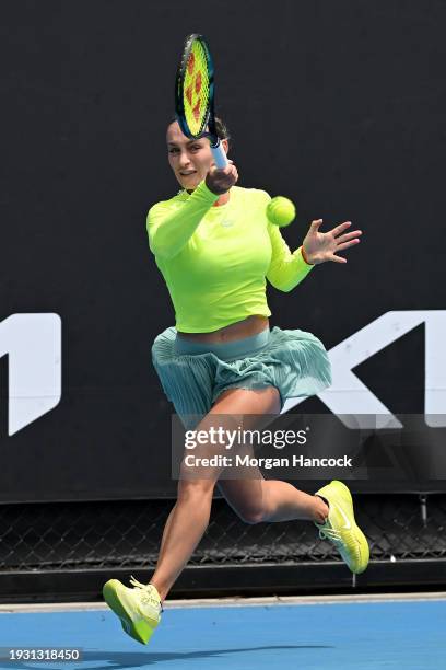 Ana Bogdan of Romania plays a forehand in their round one singles match against Linda Fruhvirtova of the Czech Republic during day one of the 2024...