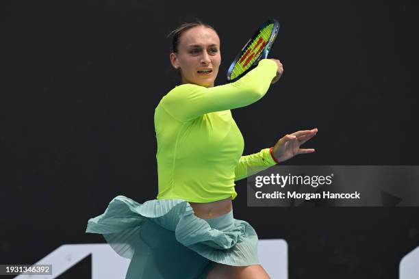 Ana Bogdan of Romania plays a forehand in their round one singles match against Linda Fruhvirtova of the Czech Republic during day one of the 2024...